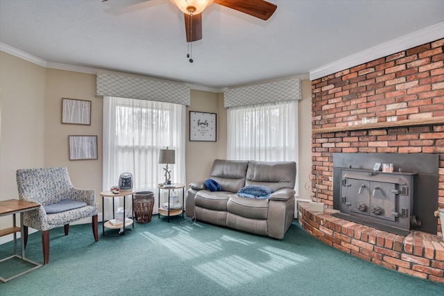 living room with crown molding, a ceiling fan, and carpet floors