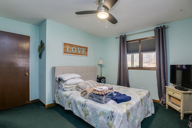 carpeted bedroom featuring baseboards and a ceiling fan