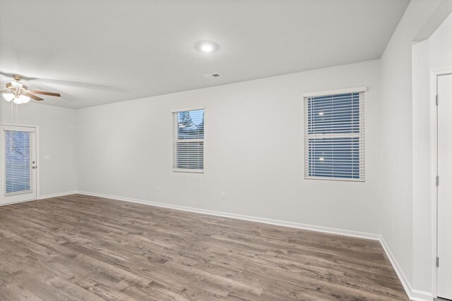 unfurnished room featuring hardwood / wood-style floors and ceiling fan