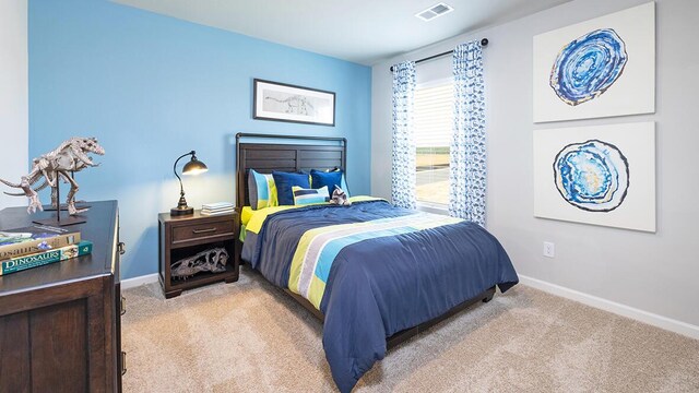 bedroom with light colored carpet