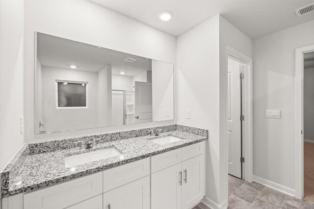 bathroom with vanity and an enclosed shower