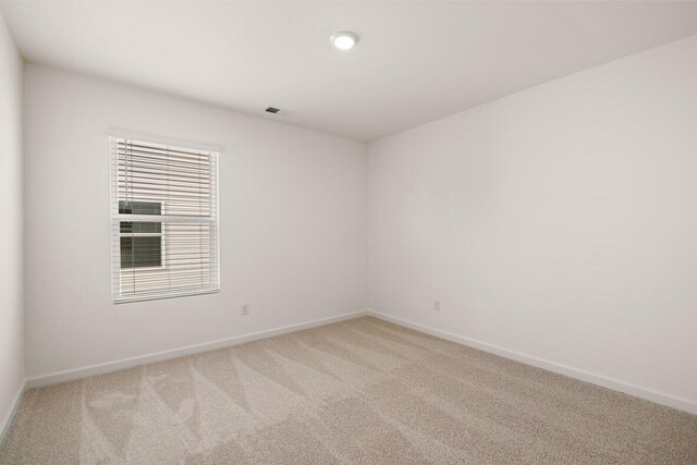 unfurnished room with carpet flooring