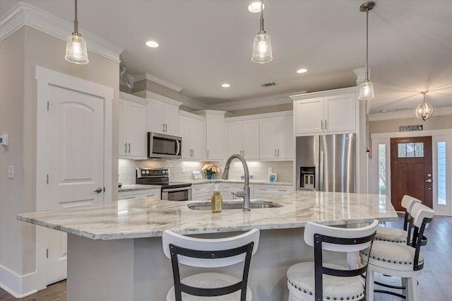 248 Amelia Dr, Mccormick, SC 29835 - kitchen featuring ornamental molding, backsplash, visible vents, stainless steel appliances, and a sink