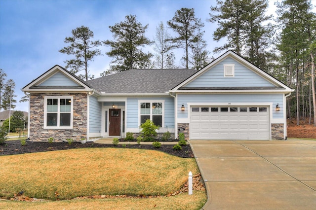 248 Amelia Dr, Mccormick, SC 29835 - view of front facade featuring roof with shingles, driveway, stone siding, an attached garage, and a front yard