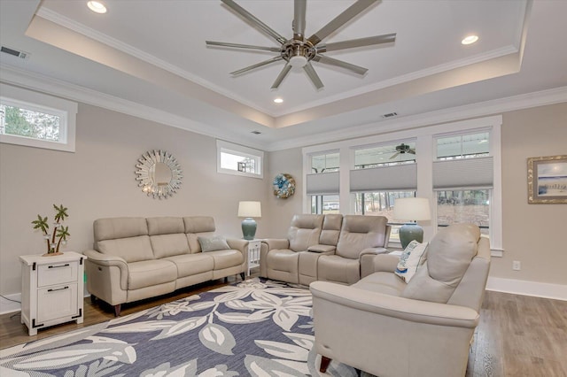 248 Amelia Dr, Mccormick, SC 29835 - living room featuring wood finished floors, visible vents, a ceiling fan, and a raised ceiling
