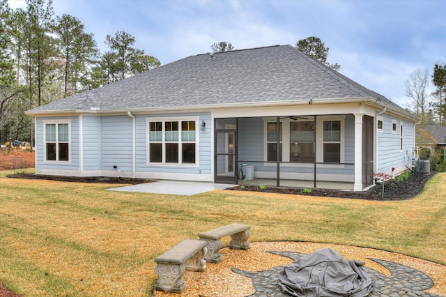 248 Amelia Dr, Mccormick, SC 29835 - back of property featuring a patio area, a shingled roof, a sunroom, and a lawn