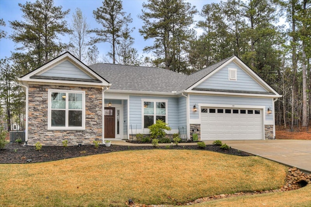 248 Amelia Dr, Mccormick, SC 29835 - view of front facade featuring a garage, a front lawn, stone siding, and concrete driveway