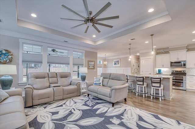248 Amelia Dr, Mccormick, SC 29835 - living area with a tray ceiling, ornamental molding, and ceiling fan