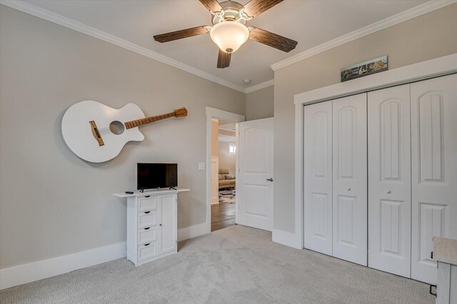 248 Amelia Dr, Mccormick, SC 29835 - unfurnished bedroom with baseboards, a closet, crown molding, ceiling fan, and light colored carpet