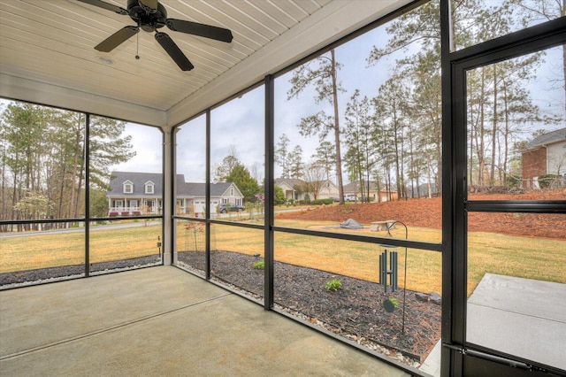 248 Amelia Dr, Mccormick, SC 29835 - unfurnished sunroom with a residential view and a ceiling fan