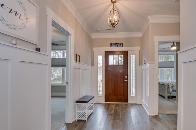 248 Amelia Dr, Mccormick, SC 29835 - entryway featuring crown molding, visible vents, a wealth of natural light, and wainscoting