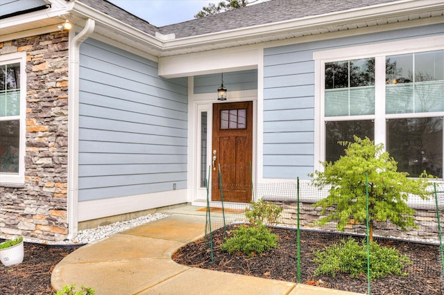 248 Amelia Dr, Mccormick, SC 29835 - doorway to property featuring stone siding and roof with shingles