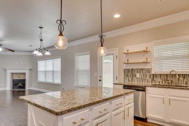 5410 Victoria Fls, Grovetown, GA 30813 - kitchen with stainless steel dishwasher, a sink, crown molding, a ceiling fan, and a center island