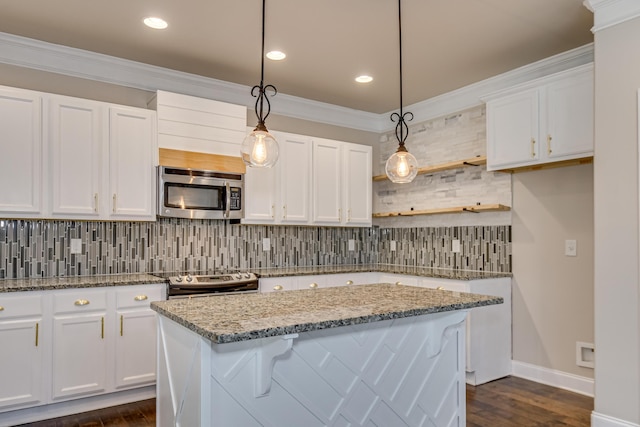 5410 Victoria Fls, Grovetown, GA 30813 - kitchen featuring stainless steel appliances, tasteful backsplash, white cabinetry, a center island, and crown molding