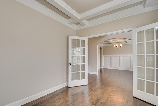 5410 Victoria Fls, Grovetown, GA 30813 - spare room with coffered ceiling, ornamental molding, arched walkways, beamed ceiling, and dark wood-style flooring