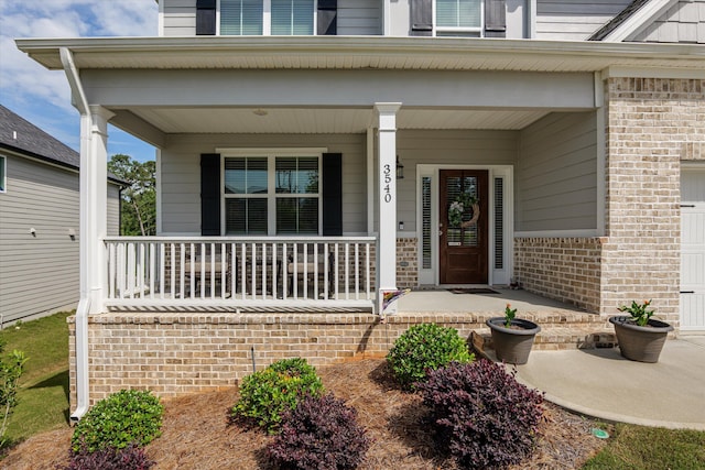 3540 Hilltop Trl, Evans, GA 30809 - property entrance featuring a porch and brick siding
