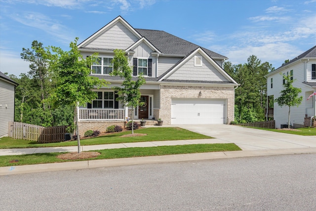 3540 Hilltop Trl, Evans, GA 30809 - craftsman-style home with concrete driveway, covered porch, brick siding, board and batten siding, and a shingled roof