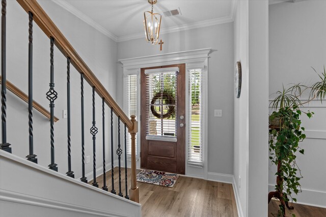3540 Hilltop Trl, Evans, GA 30809 - entrance foyer with wood finished floors, stairs, crown molding, a chandelier, and baseboards