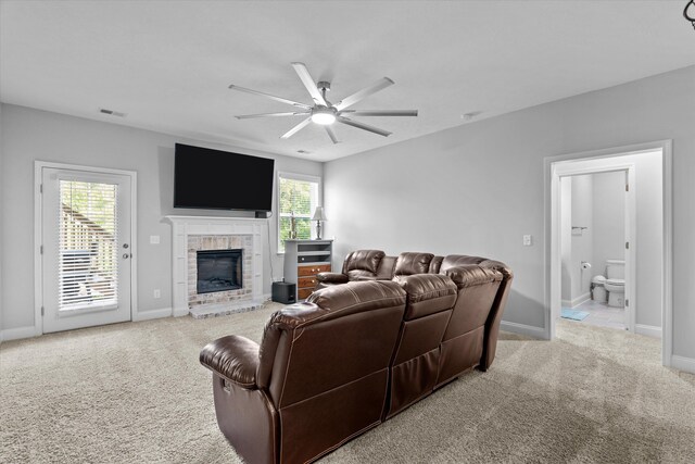 3540 Hilltop Trl, Evans, GA 30809 - living room featuring a ceiling fan, carpet, plenty of natural light, and a fireplace