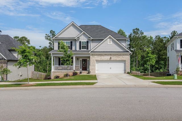 3540 Hilltop Trl, Evans, GA 30809 - craftsman-style house with driveway, covered porch, brick siding, and a shingled roof