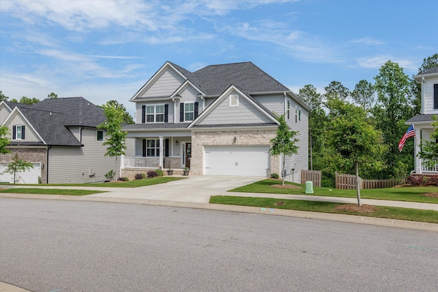 3540 Hilltop Trl, Evans, GA 30809 - view of front facade with driveway, brick siding, a porch, and roof with shingles