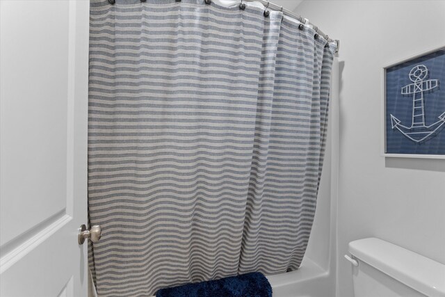 3540 Hilltop Trl, Evans, GA 30809 - bathroom featuring toilet and curtained shower
