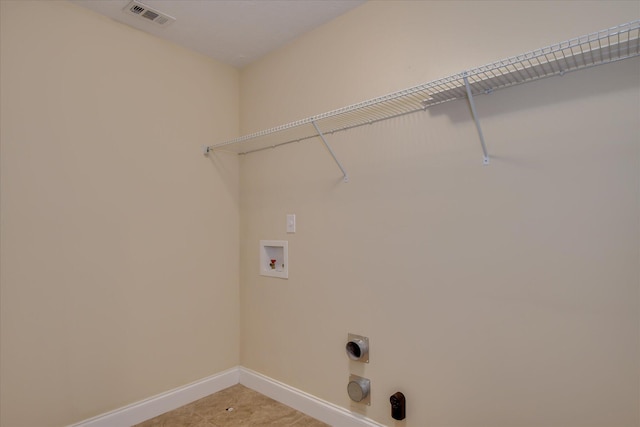 washroom featuring washer hookup, baseboards, and hookup for an electric dryer