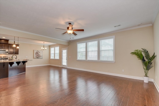 unfurnished living room with a chandelier, dark wood-type flooring, a ceiling fan, a sink, and baseboards