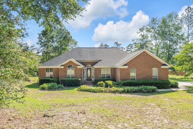3974 Bolton St, Augusta, GA 30909 - view of front facade featuring a front yard, brick siding, and a shingled roof