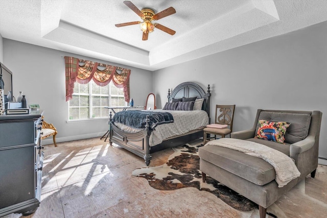 3974 Bolton St, Augusta, GA 30909 - bedroom with baseboards, a raised ceiling, a textured ceiling, and a ceiling fan
