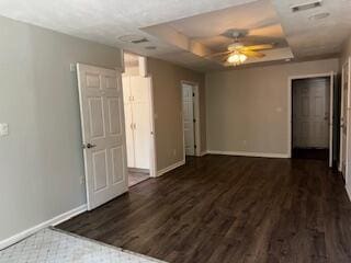 4512 Country Glen Cir, Grovetown, GA 30813 - empty room with wood finished floors, a ceiling fan, and a raised ceiling