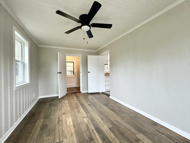 unfurnished bedroom featuring dark hardwood / wood-style flooring, ceiling fan, and ornamental molding