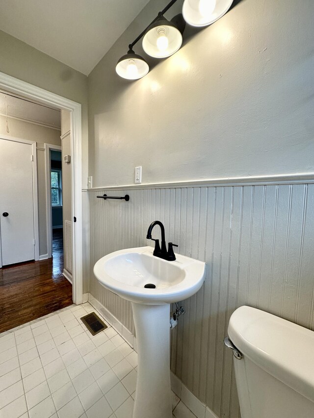 bathroom with tile patterned flooring and toilet