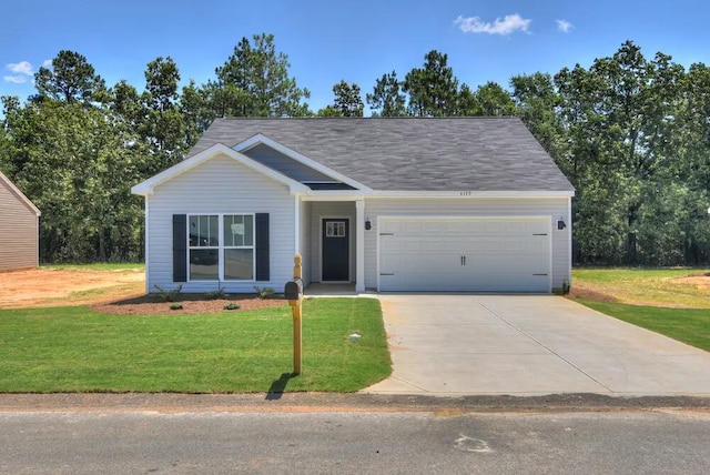 ranch-style home featuring a garage and a front lawn