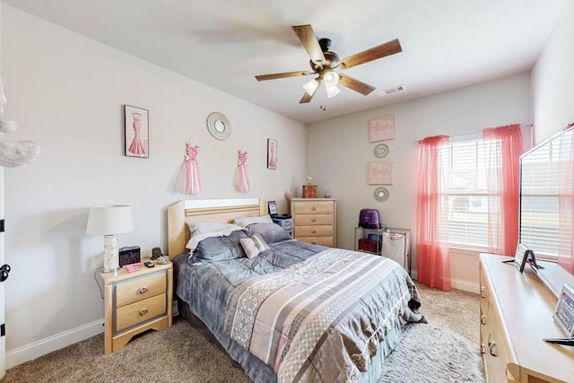 bedroom featuring ceiling fan and light carpet