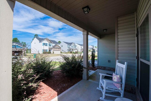 view of patio featuring a porch