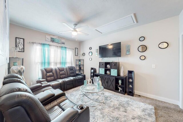 carpeted living room featuring ceiling fan