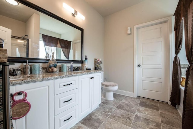 bathroom with toilet and vanity