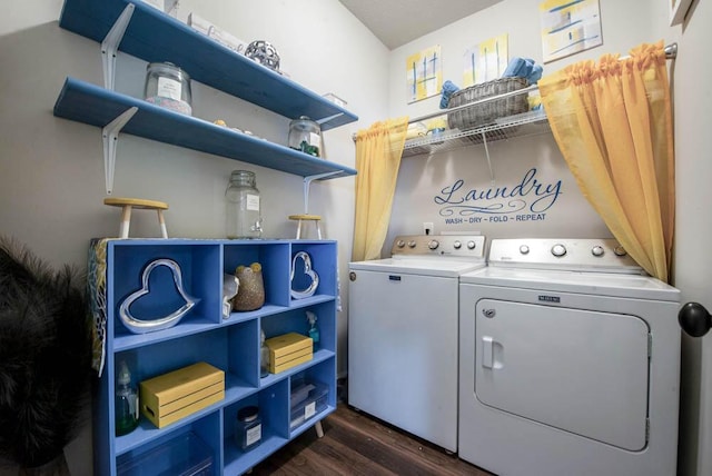 clothes washing area featuring dark hardwood / wood-style floors and separate washer and dryer