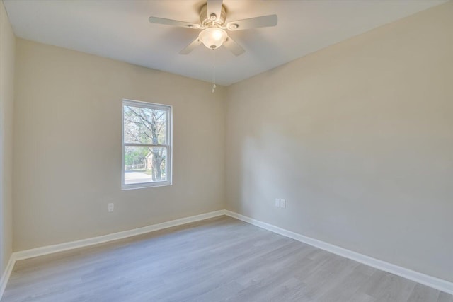 unfurnished room featuring baseboards, ceiling fan, and light wood-style floors