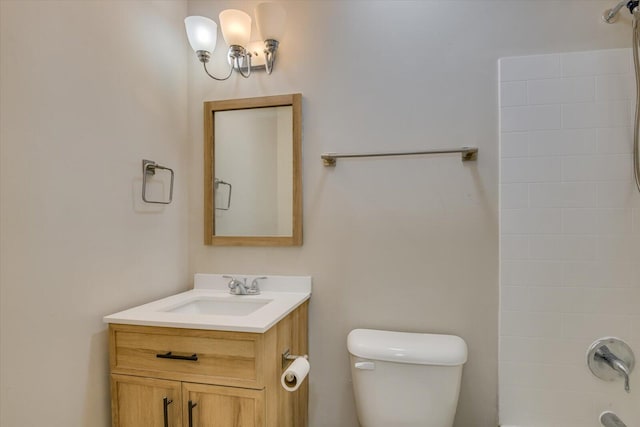 bathroom with toilet, shower / washtub combination, and vanity