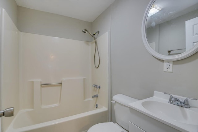 bathroom featuring vanity, toilet, and shower / bathtub combination