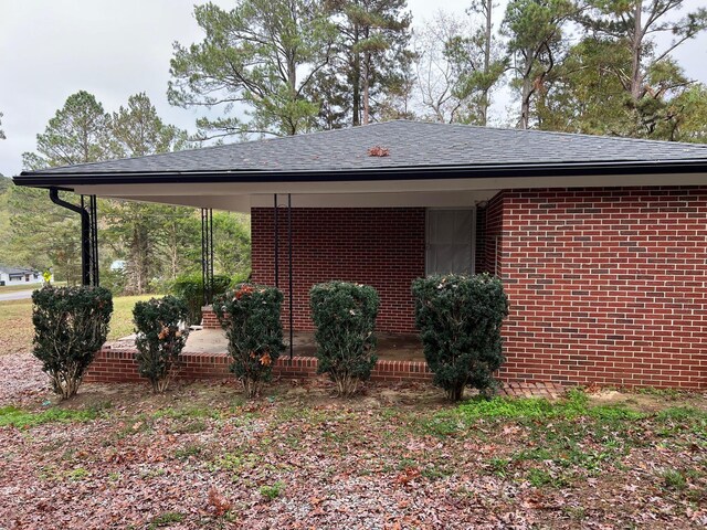 view of property exterior featuring a carport