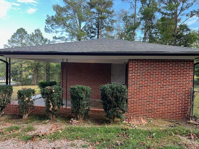 view of property exterior featuring a carport