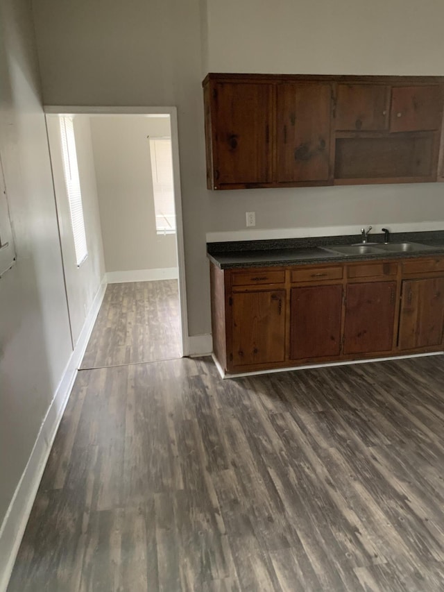 1978 Greene St, Augusta, GA 30904 - kitchen with a sink, dark wood finished floors, baseboards, and dark countertops