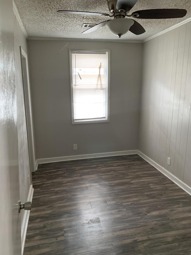 1978 Greene St, Augusta, GA 30904 - empty room featuring dark wood-style flooring, baseboards, a textured ceiling, crown molding, and ceiling fan