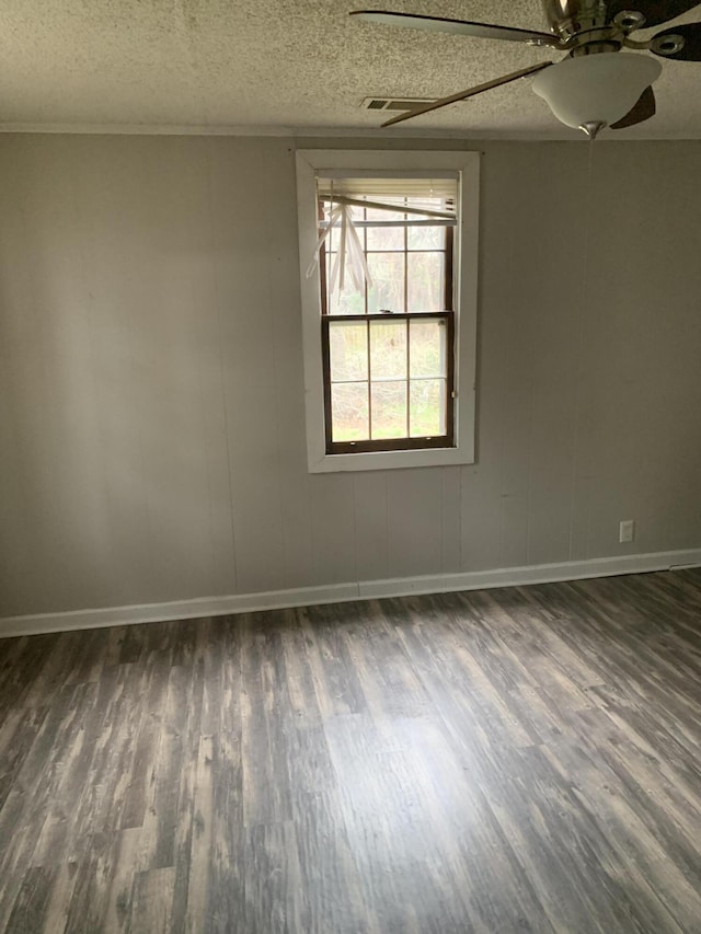 1978 Greene St, Augusta, GA 30904 - spare room featuring dark wood-type flooring, ceiling fan, baseboards, and a textured ceiling