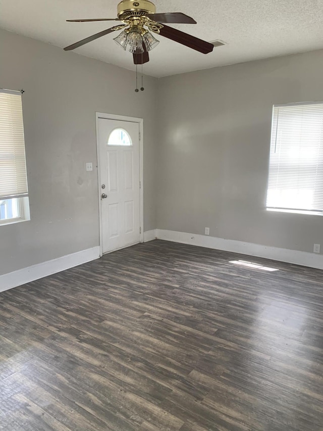 1978 Greene St, Augusta, GA 30904 - entryway featuring baseboards, a textured ceiling, a ceiling fan, dark wood-type flooring, and visible vents