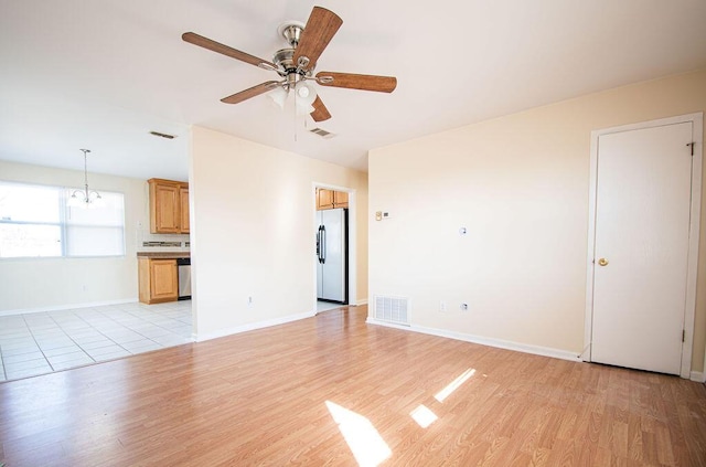 unfurnished living room with ceiling fan and light wood-type flooring