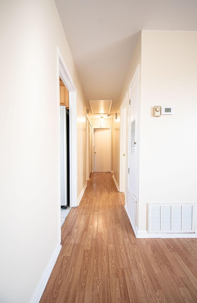 hall with light wood-type flooring